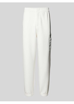 Spodnie dresowe o kroju regular fit z kieszenią cargo ze sklepu Peek&Cloppenburg  w kategorii Spodnie męskie - zdjęcie 173984530