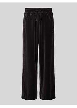 Spodnie dresowe o kroju oversized z elastycznym pasem ze sklepu Peek&Cloppenburg  w kategorii Spodnie męskie - zdjęcie 173991860