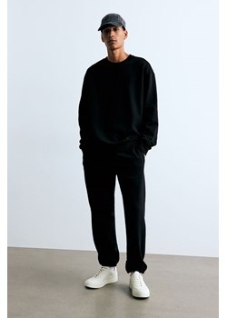 H & M - Spodnie dresowe Relaxed Fit - Czarny ze sklepu H&M w kategorii Spodnie męskie - zdjęcie 174052041