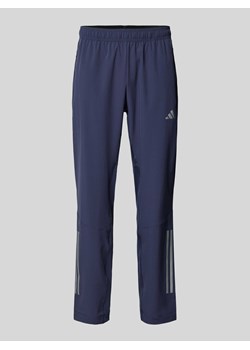 Spodnie treningowe o kroju regular fit z kieszeniami zapinanymi na zamek błyskawiczny ze sklepu Peek&Cloppenburg  w kategorii Spodnie męskie - zdjęcie 174088364