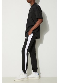 Puma spodnie dresowe kolor czarny wzorzyste 530098-01 ze sklepu PRM w kategorii Spodnie męskie - zdjęcie 174098172