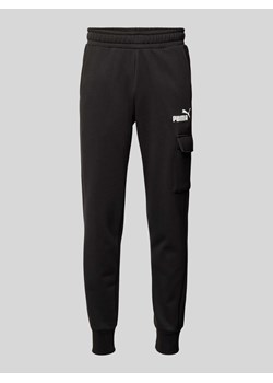 Spodnie dresowe o kroju slim fit z kieszenią cargo ze sklepu Peek&Cloppenburg  w kategorii Spodnie męskie - zdjęcie 174116974