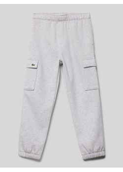 Spodnie dresowe z kieszeniami cargo ze sklepu Peek&Cloppenburg  w kategorii Spodnie chłopięce - zdjęcie 174122580