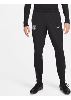 Męskie spodnie piłkarskie z dzianiny Nike Dri-FIT FC Barcelona Strike - Czerń ze sklepu Nike poland w kategorii Spodnie męskie - zdjęcie 174506152