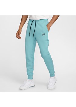 Joggery męskie Nike Sportswear Tech Fleece - Niebieski ze sklepu Nike poland w kategorii Spodnie męskie - zdjęcie 174573282