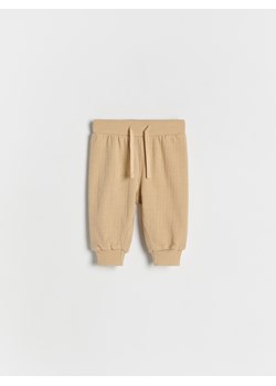 Reserved - Bawełniane spodnie - beżowy ze sklepu Reserved w kategorii Spodnie i półśpiochy - zdjęcie 174827841