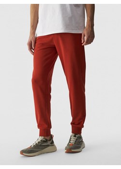 Męskie spodnie dresowe joggery 4F 4FWMM00TTROM0942 - czerwone ze sklepu Sportstylestory.com w kategorii Spodnie męskie - zdjęcie 175551532