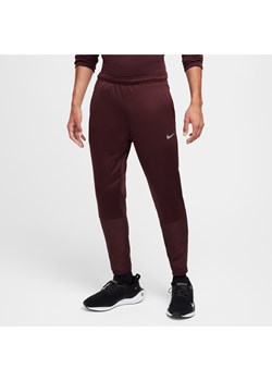 Męskie wodoodporne spodnie do biegania Therma-FIT Nike Sphere Challenger - Czerwony ze sklepu Nike poland w kategorii Spodnie męskie - zdjęcie 175589810