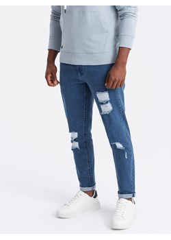 Washowane spodnie męskie jeansowe TAPERED FIT z przetarciami – niebieskie V2 OM-PADP-0163 ze sklepu ombre w kategorii Jeansy męskie - zdjęcie 176301224