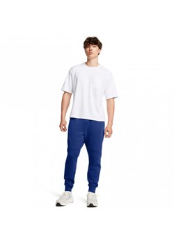 Męskie spodnie treningowe Under Armour UA Unstoppable Flc Jgr Eu - niebieskie ze sklepu Sportstylestory.com w kategorii Spodnie męskie - zdjęcie 176552411