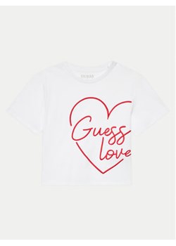 Guess T-Shirt J4YI06 K8HM4 Biały Boxy Fit ze sklepu MODIVO w kategorii Bluzki dziewczęce - zdjęcie 176638652