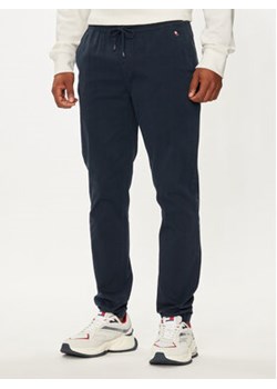 Tommy Jeans Joggery Austin DM0DM20456 Granatowy Slim Fit ze sklepu MODIVO w kategorii Spodnie męskie - zdjęcie 176716901