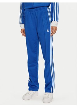 adidas Spodnie dresowe Beckenbauer IY2228 Niebieski Regular Fit ze sklepu MODIVO w kategorii Spodnie damskie - zdjęcie 176805114