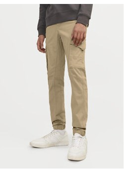 Jack&Jones Junior Spodnie materiałowe Paul 12193900 Beżowy Slim Fit ze sklepu MODIVO w kategorii Spodnie chłopięce - zdjęcie 176942383