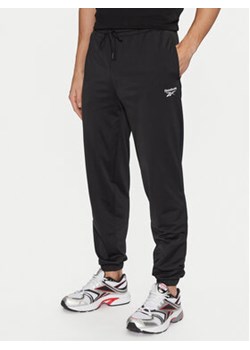 Reebok Spodnie dresowe Vector 100063237 Czarny Regular Fit ze sklepu MODIVO w kategorii Spodnie męskie - zdjęcie 177050652