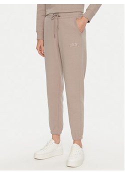 DKNY Sport Spodnie dresowe DP4P3471 Beżowy Regular Fit ze sklepu MODIVO w kategorii Spodnie damskie - zdjęcie 177223833