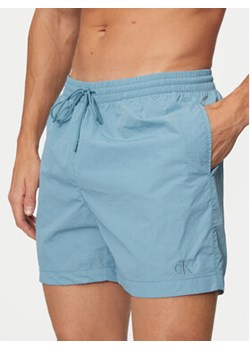 Calvin Klein Swimwear Szorty kąpielowe KM0KM01080 Niebieski Regular Fit ze sklepu MODIVO w kategorii Kąpielówki - zdjęcie 177301370