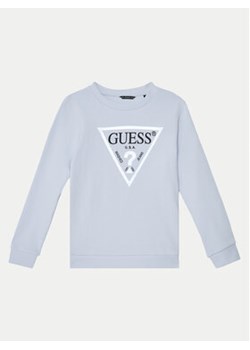 Guess Bluza J74Q10 KAUG0 Błękitny Regular Fit ze sklepu MODIVO w kategorii Bluzy chłopięce - zdjęcie 177489350