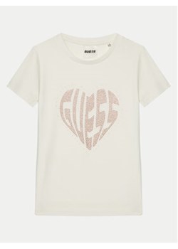 Guess T-Shirt J5RI46 J1314 Écru Regular Fit ze sklepu MODIVO w kategorii Bluzki dziewczęce - zdjęcie 177605882