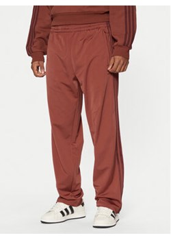 adidas Spodnie dresowe adicolor Classics Firebird JP2541 Czerwony Regular Fit ze sklepu MODIVO w kategorii Spodnie męskie - zdjęcie 177613223