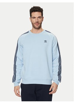 adidas Bluza adicolor Classics 3-Stripes JN7026 Błękitny Regular Fit ze sklepu MODIVO w kategorii Bluzy męskie - zdjęcie 177619192