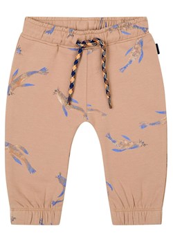 Noppies Spodnie dresowe "Guipry" w kolorze beżowym ze sklepu Limango Polska w kategorii Spodnie i półśpiochy - zdjęcie 177631644