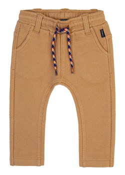 Noppies Spodnie dresowe "Groix" w kolorze jasnobrązowym ze sklepu Limango Polska w kategorii Spodnie i półśpiochy - zdjęcie 177631653