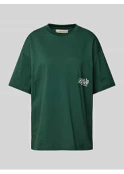 T-shirt o kroju oversized z nadrukiem z logo ze sklepu Peek&Cloppenburg  w kategorii Bluzki damskie - zdjęcie 177811240