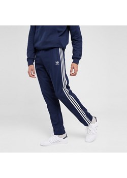 ADIDAS SPODNIE BECKENBAUER TP ze sklepu JD Sports  w kategorii Spodnie męskie - zdjęcie 178193000