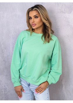 ASYMETRYCZNA BLUZA OVERSIZE Z PRZESZYCIAMI NA RĘKAWACH- ZIELONA ze sklepu olika.com.pl w kategorii Bluzy damskie - zdjęcie 178212490