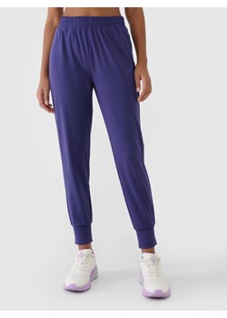 Damskie spodnie treningowe 4F 4FRSS25TFTRF0789 - niebieskie ze sklepu Sportstylestory.com w kategorii Spodnie damskie - zdjęcie 178363132