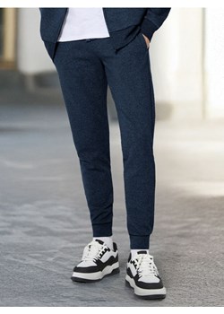 Sinsay - Spodnie dresowe slim jogger - niebieski ze sklepu Sinsay w kategorii Spodnie męskie - zdjęcie 178371560