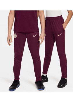 Dzianinowe spodnie piłkarskie dla dużych dzieci Nike Dri-FIT Paris Saint-Germain Strike - Czerwony ze sklepu Nike poland w kategorii Spodnie chłopięce - zdjęcie 178602051