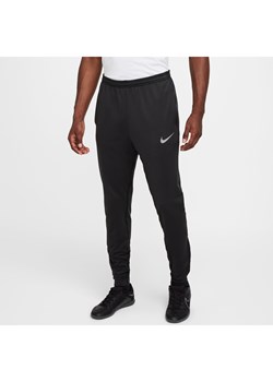 Męskie spodnie piłkarskie Therma-FIT Nike Strike - Czerń ze sklepu Nike poland w kategorii Spodnie męskie - zdjęcie 178605670