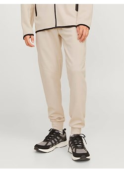 Jack &amp; Jones Spodnie dresowe w kolorze kremowym ze sklepu Limango Polska w kategorii Spodnie męskie - zdjęcie 179074591