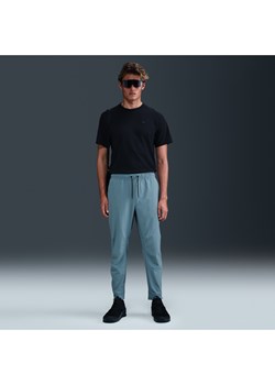 Męskie uniwersalne spodnie ze ściągaczami i zamkami Dri-FIT Nike Unlimited - Niebieski ze sklepu Nike poland w kategorii Spodnie męskie - zdjęcie 179308302