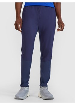 Męskie spodnie do biegania 4F 4FWSS25TFTRM0793 - granatowe ze sklepu Sportstylestory.com w kategorii Spodnie męskie - zdjęcie 179596651
