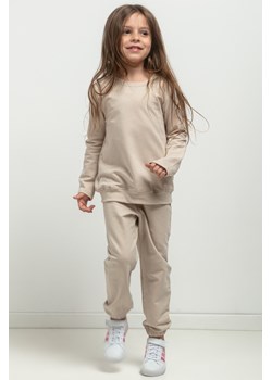 Spodnie dresowe typu jogger dla dziewczynki - jasnobeżowe ze sklepu Cudmoda w kategorii Spodnie dziewczęce - zdjęcie 179651964