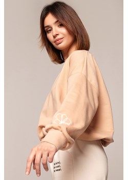 Bluza z dekoltem na plecach - beżowa ze sklepu Cudmoda w kategorii Bluzy damskie - zdjęcie 179656623