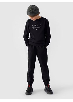 4F Spodnie dresowe w kolorze czarnym - id: 16877519 - marki 4F - 179826351 4F Spodnie dresowe w kolorze czarnym ze sklepu Limango Polska w kategorii Spodnie chłopięce - zdjęcie 179826351