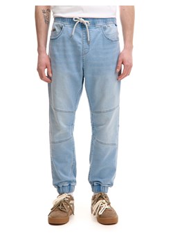 Cropp - Jeansy jogger z ozdobnymi przeszyciami - niebieski ze sklepu Cropp w kategorii Jeansy męskie - zdjęcie 180227494