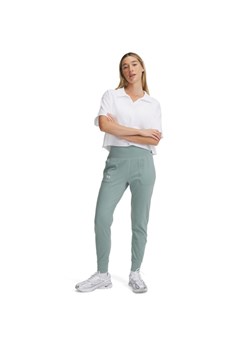 Damskie spodnie treningowe Under Armour Motion Jogger - zielone ze sklepu Sportstylestory.com w kategorii Spodnie damskie - zdjęcie 180375054