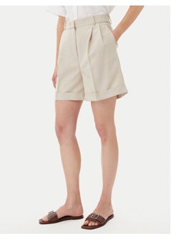Tommy Hilfiger Szorty materiałowe WW0WW44767 Beżowy Regular Fit ze sklepu MODIVO w kategorii Szorty - zdjęcie 180403461