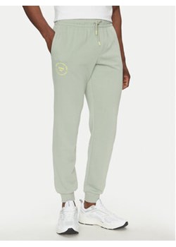 Jack&Jones Spodnie dresowe Gordon 12268442 Zielony Regular Fit ze sklepu MODIVO w kategorii Spodnie męskie - zdjęcie 180444381