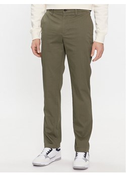 Tommy Hilfiger Chinosy Denton MW0MW33938 Khaki Slim Fit ze sklepu MODIVO w kategorii Spodnie męskie - zdjęcie 181033584