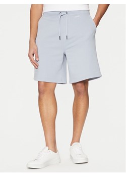 Calvin Klein Szorty sportowe Nano Logo K10K112689 Niebieski Regular Fit ze sklepu MODIVO w kategorii Spodenki męskie - zdjęcie 181034094