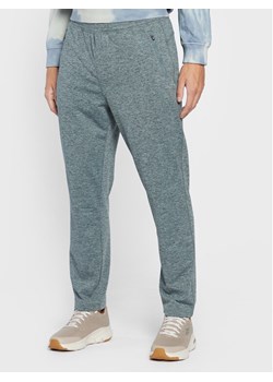 Skechers Spodnie dresowe Ultra Go M1PT77 Niebieski Tapered Fit ze sklepu MODIVO w kategorii Spodnie męskie - zdjęcie 181034341