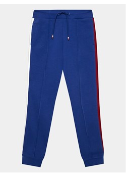 Tommy Hilfiger Spodnie dresowe Globral Stripes KB0KB08404 D Niebieski Regular Fit ze sklepu MODIVO w kategorii Spodnie chłopięce - zdjęcie 181035924