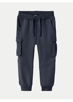 NAME IT Spodnie dresowe 13221426 Granatowy Regular Fit ze sklepu MODIVO w kategorii Spodnie chłopięce - zdjęcie 181037722