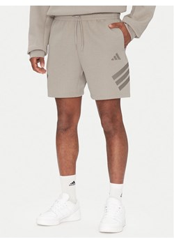 adidas Szorty sportowe Future Icons 3-Stripes JD4882 Beżowy Regular Fit ze sklepu MODIVO w kategorii Spodenki męskie - zdjęcie 181038713